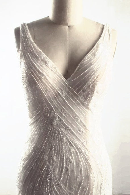 Elegant SWAN FANTASY wedding dress by PETRA KARA BRIDAL featuring intricate lace details and a flowing train.