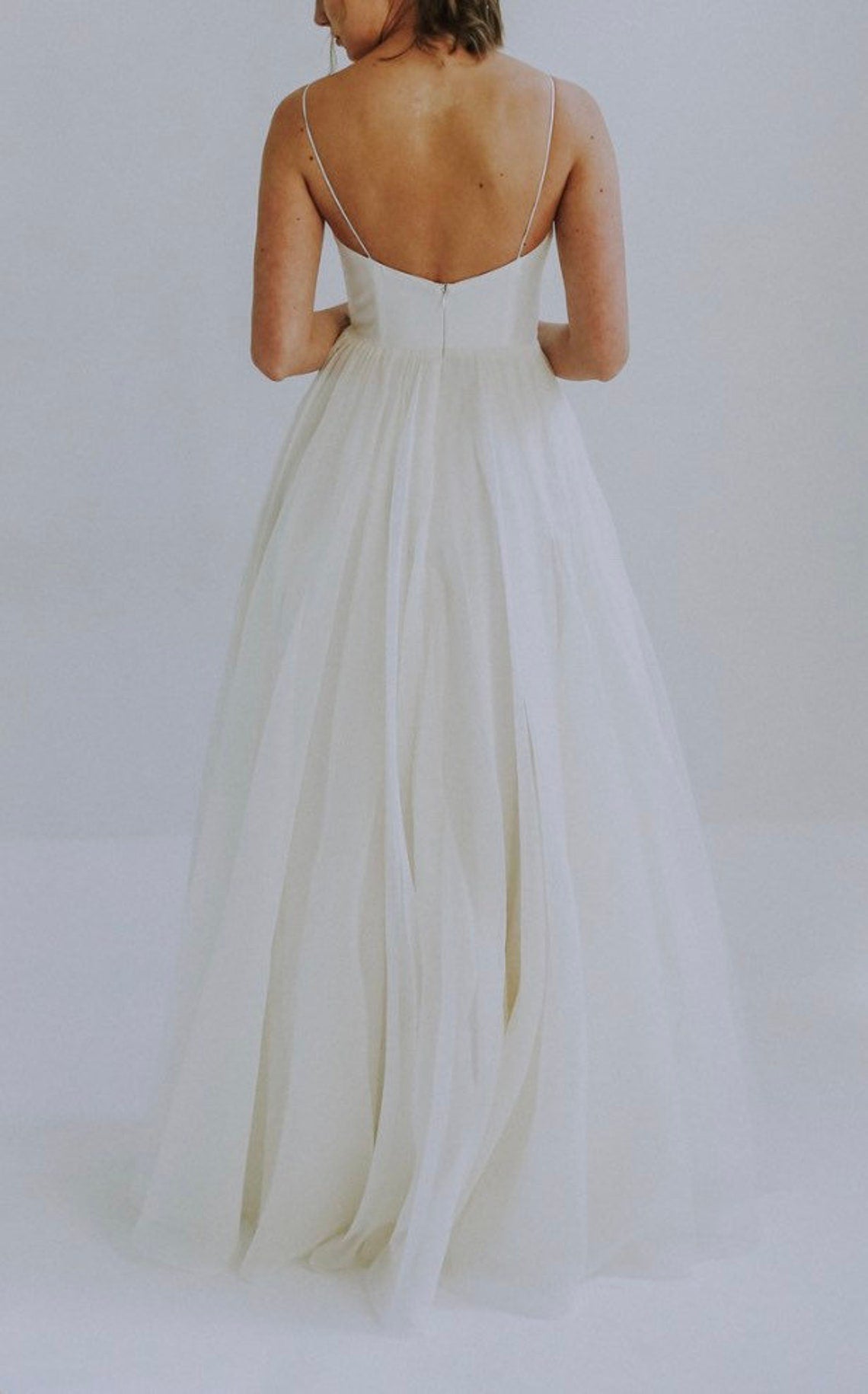 Elegant BALLET wedding dress by Atelier Calliste featuring intricate lace details and a flowing train, perfect for bridal events.