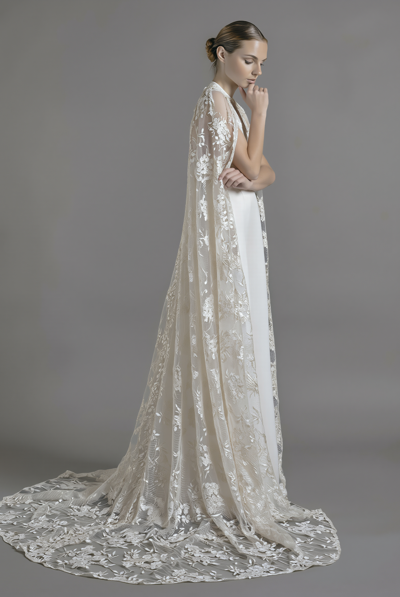 Petra Kara Bridal dramatic lace cape in size S-XXXL, featuring intricate lace details and flowing design.