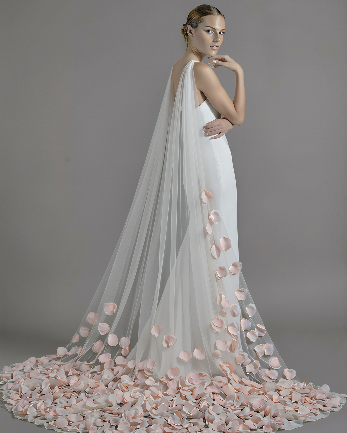 Atelier Calliste 3D flowers veil cape with low petals, featuring intricate floral design and delicate fabric for elegant wear.