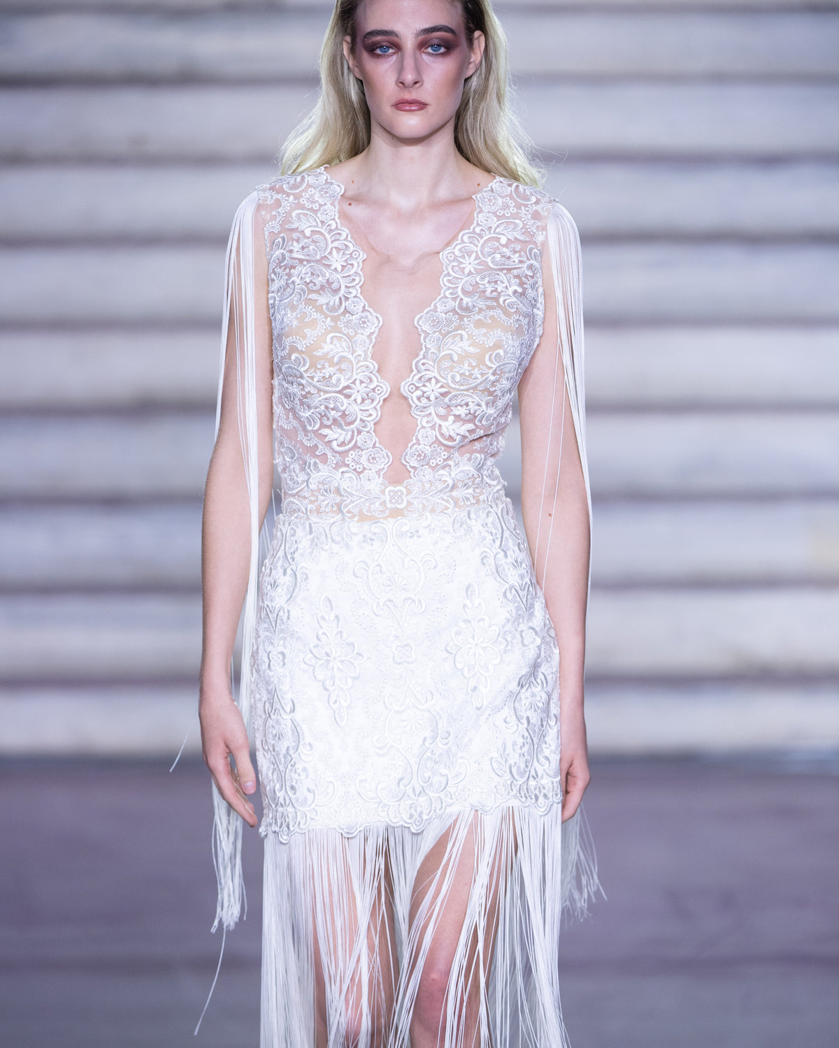 PETRA KARA PALACE lace and fringe boho wedding dress with intricate embroidery and flowing design, perfect for bohemian brides.
