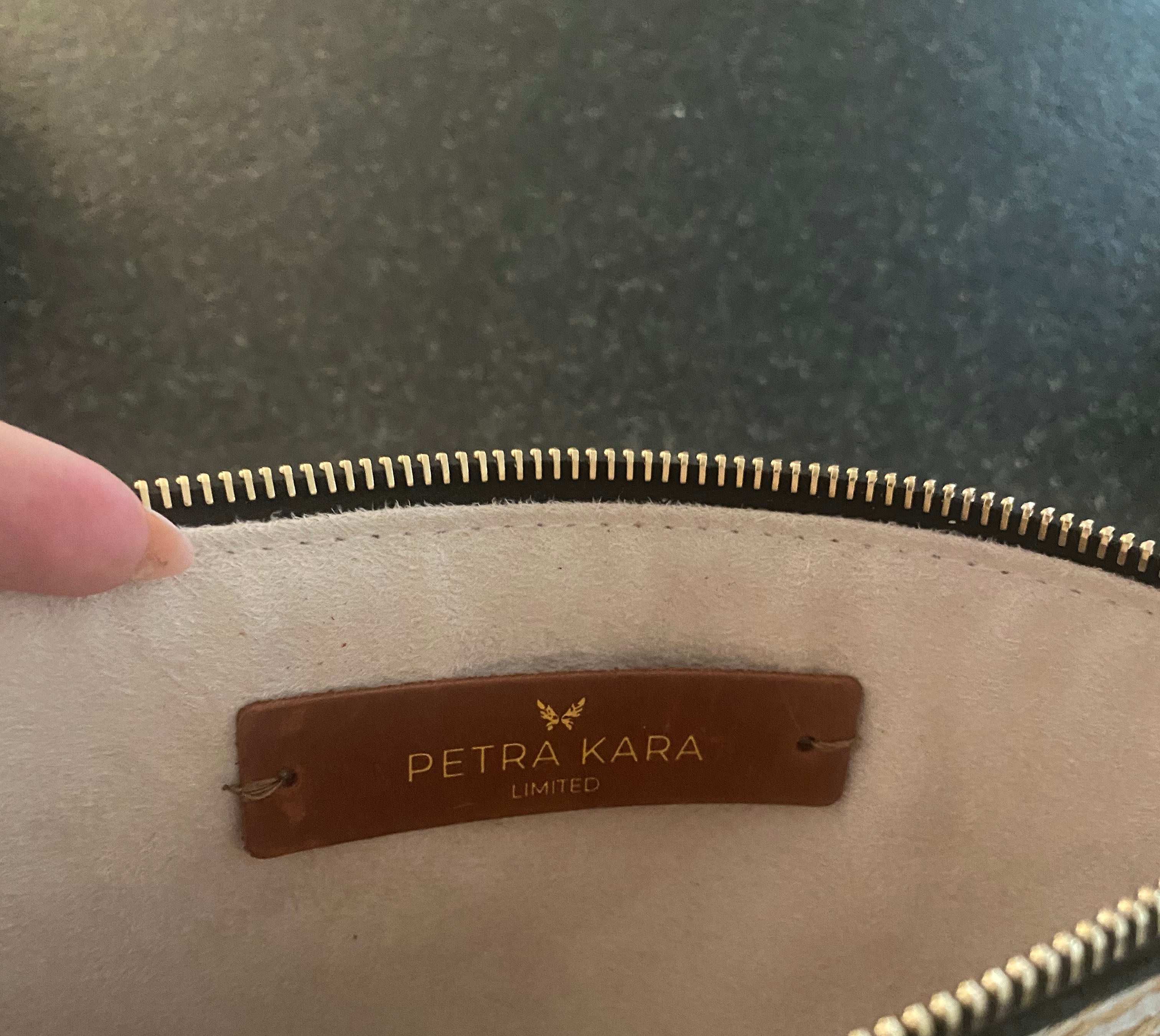Leather purse from Petra Kara Revolution Limited Collection, Captain style, with sleek design and textured leather finish.