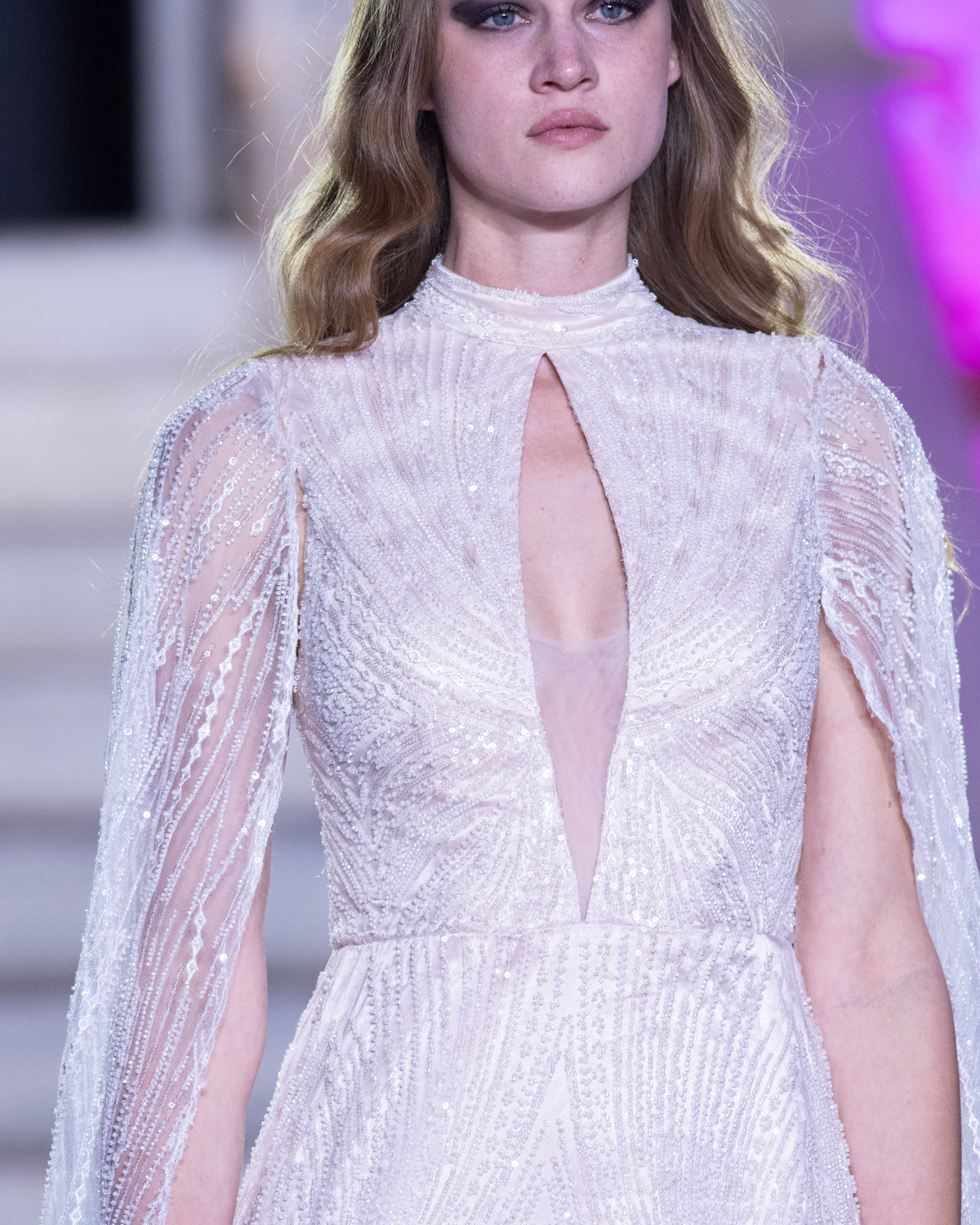 Petra Kara Celestial Aura gown with flowing fabric and removable sleeves, featuring intricate celestial-inspired details.