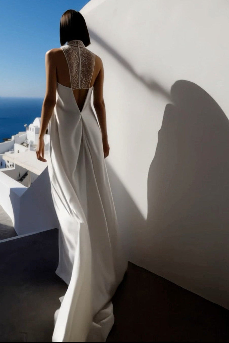 Petra Kara Minimal Ekati Draped Dress in neutral fabric, showcasing elegant draping and sleek silhouette on a model.