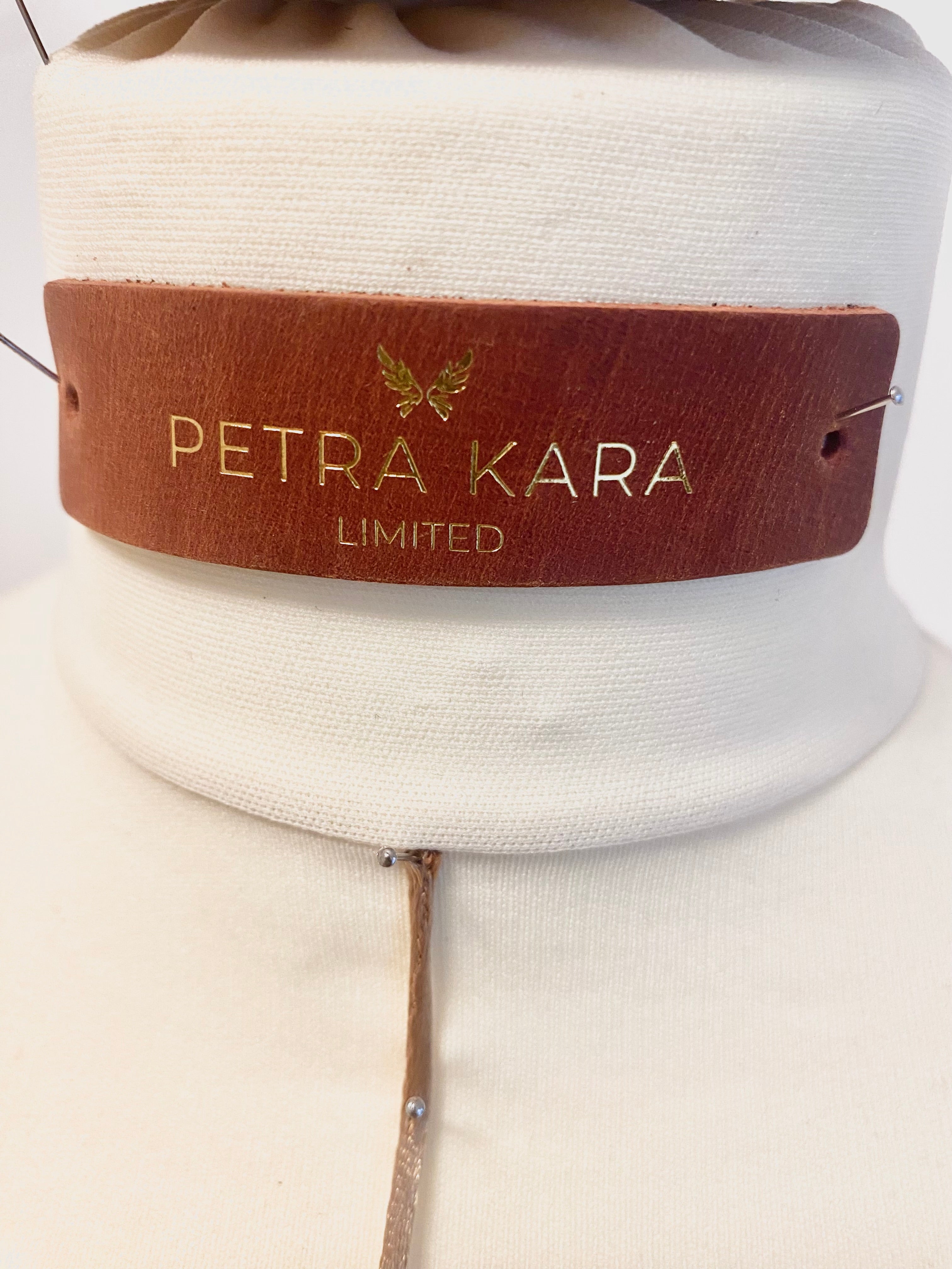 Petra Kara architectural corset dress featuring structured design and elegant silhouette on a mannequin.