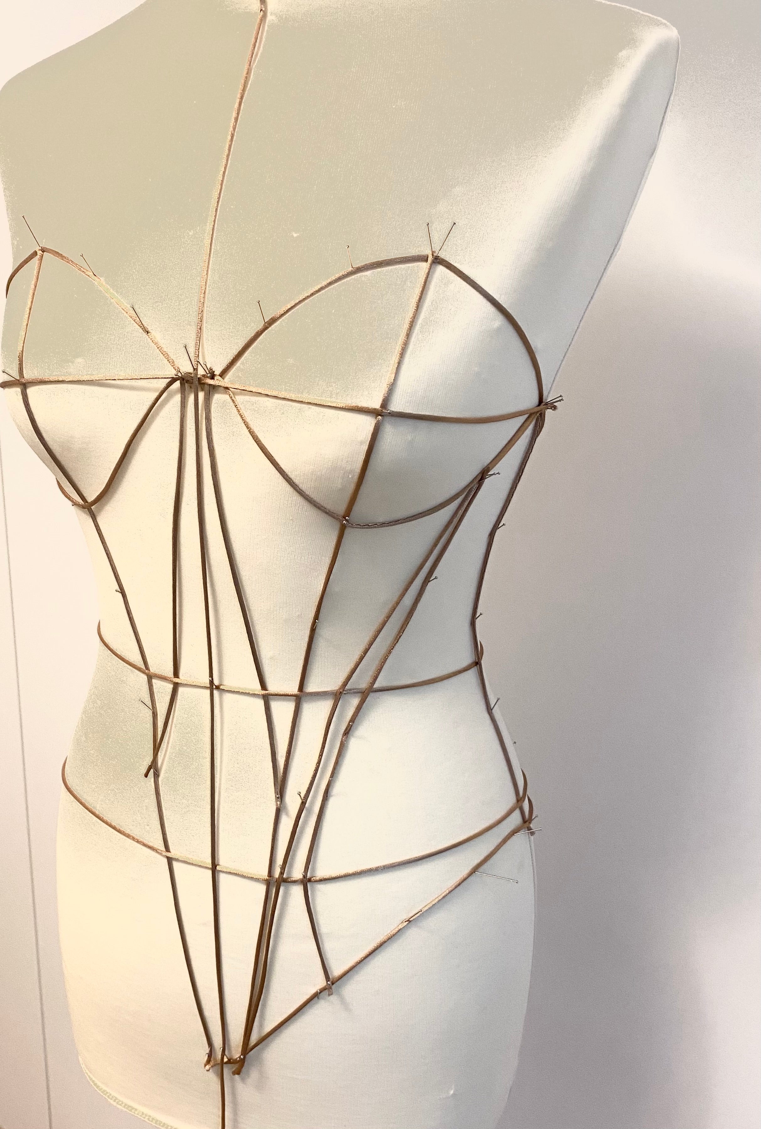 Petra Kara Architectural Corset Dress featuring structured design and elegant silhouette in a soft fabric.