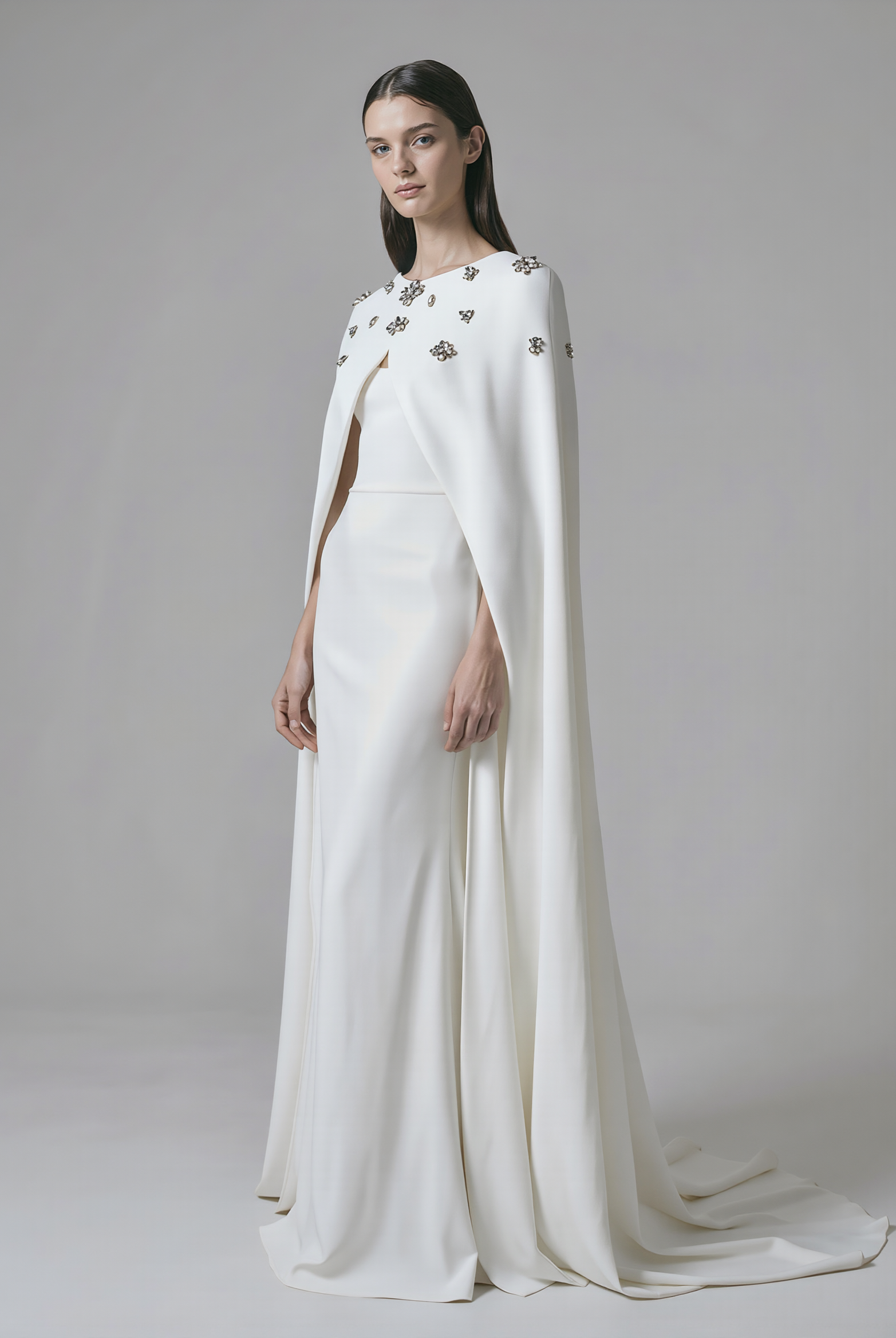 Beaded cape by Atelier Calliste in size S to XXXL, featuring intricate beadwork and elegant drape.