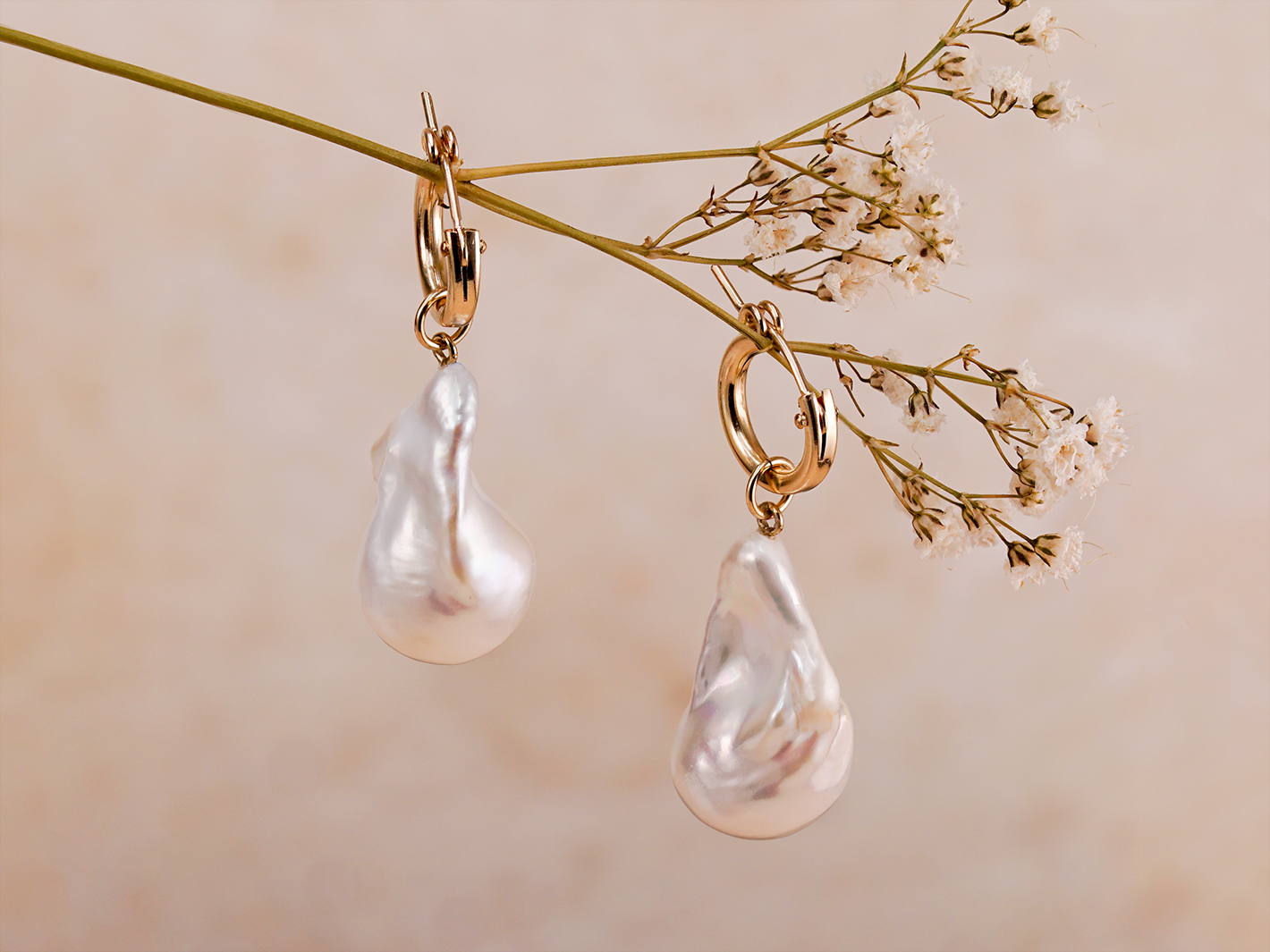 PM Atelier Paris Hoops earrings with gold-tone hoops and intricate design, displayed on a white background.