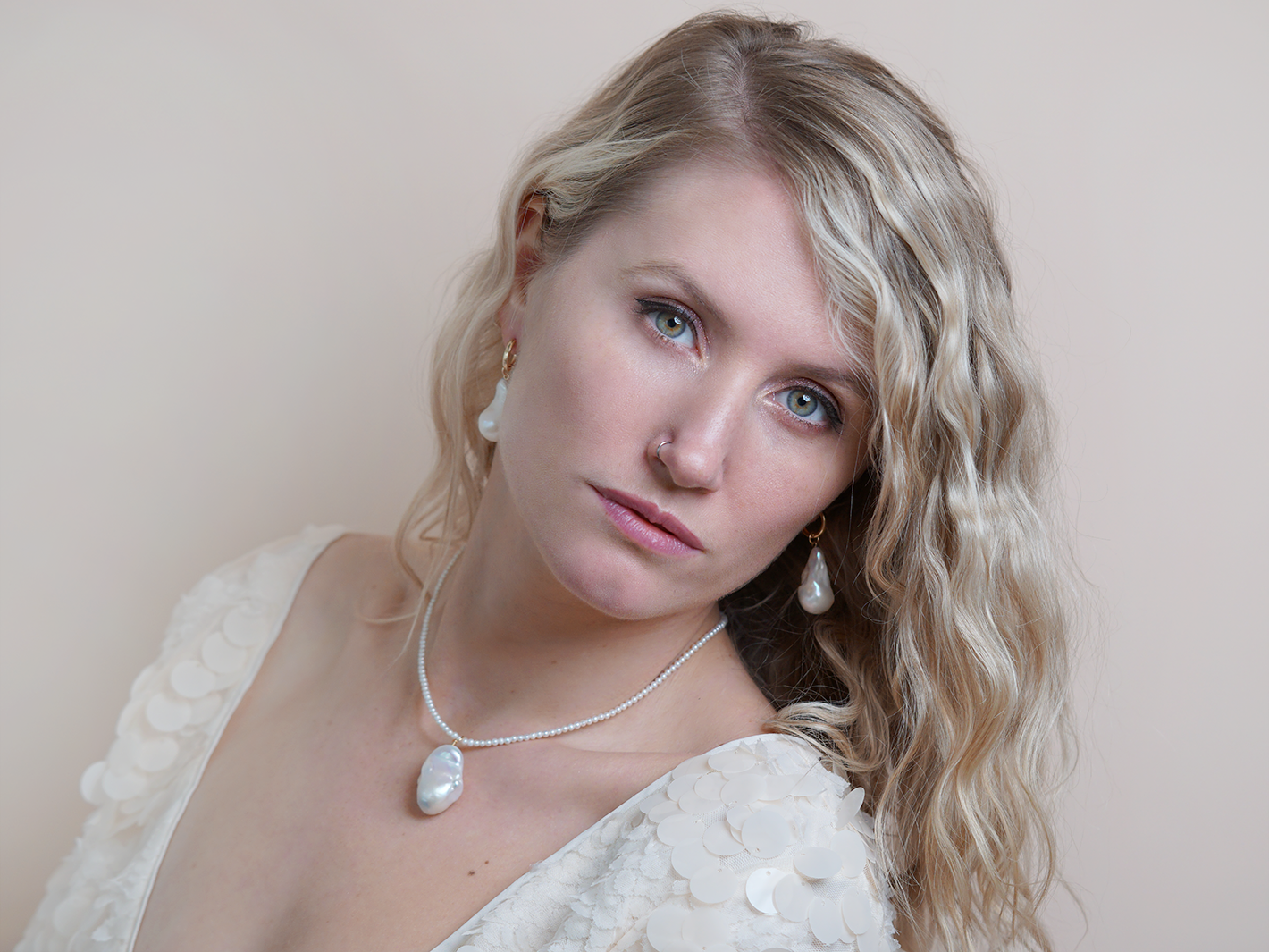 PM Atelier Paris Hoops earrings showing sleek gold hoops with a modern design and polished finish.