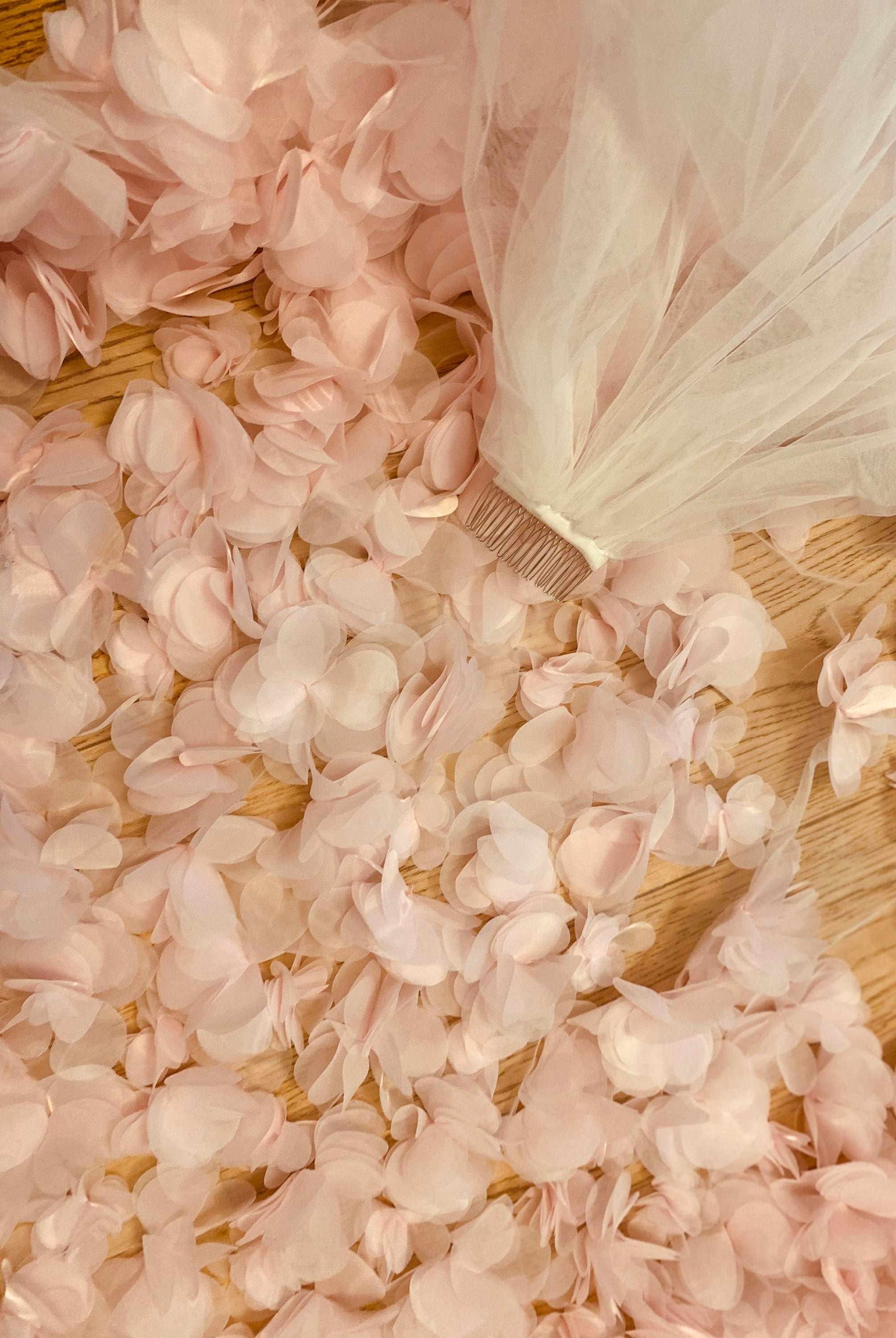 Atelier Calliste 3D flowers veil featuring delicate fabric and intricate floral details, perfect for bridal or special occasion wear.