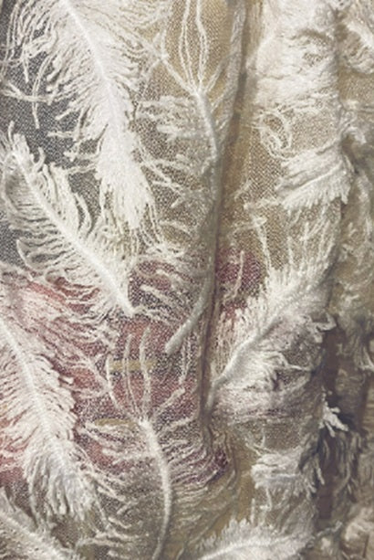 Feather veil and cape by Atelier Calliste featuring delicate feather details and flowing fabric for elegant evening wear