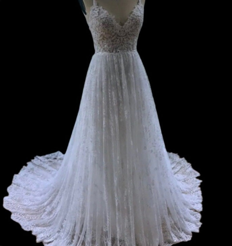 Boho wedding dress by CELINE from Atelier Calliste, featuring flowing fabric and intricate detailing for a romantic bridal look.