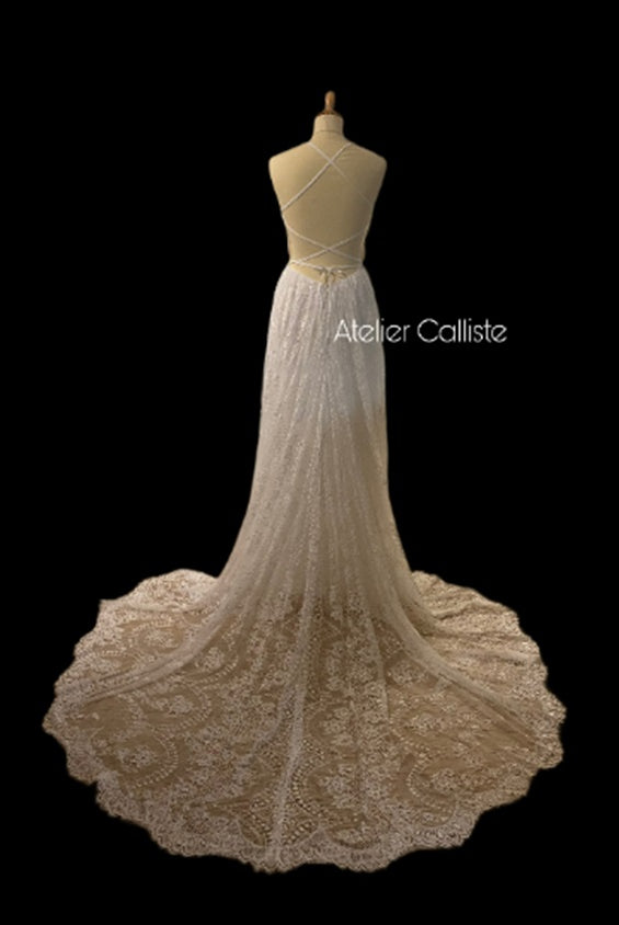Celina Boho wedding dress by Atelier Calliste featuring flowing fabric and intricate lace details for a romantic bridal look.
