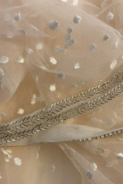 Stars boho wedding dress by Atelier Calliste with flowing fabric and intricate star embroidery, perfect for a bohemian wedding.