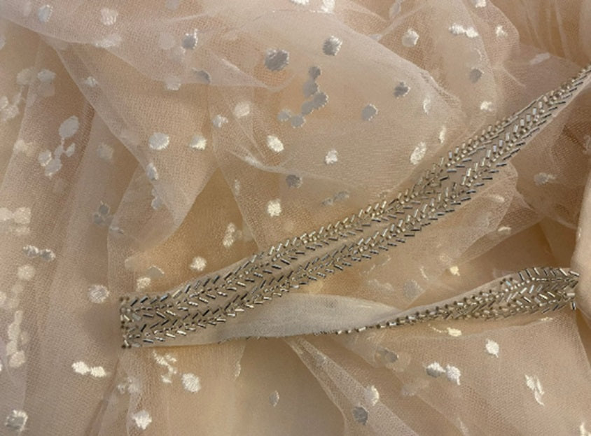 Stars boho wedding dress by Atelier Calliste with flowing fabric and intricate star embroidery, perfect for a bohemian wedding.