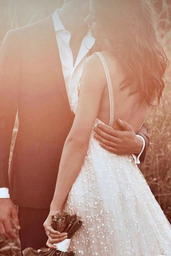 Boho wedding dress by Atelier Calliste featuring star embellishments, flowing fabric, and bohemian style for special occasions.
