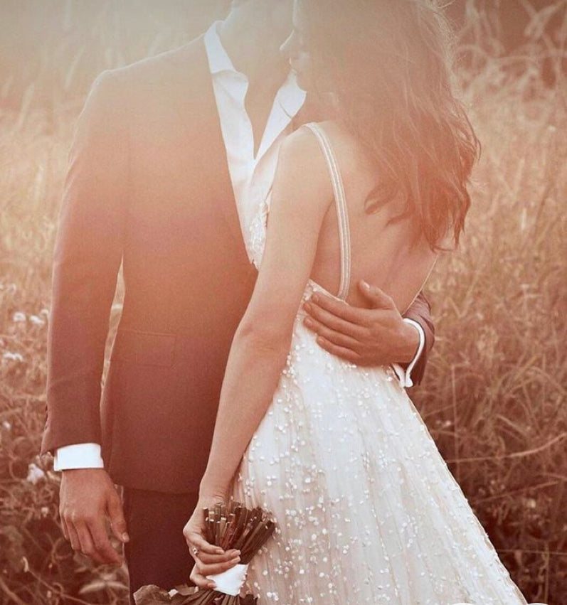 Boho wedding dress by Atelier Calliste featuring star embellishments, flowing fabric, and bohemian style for special occasions.