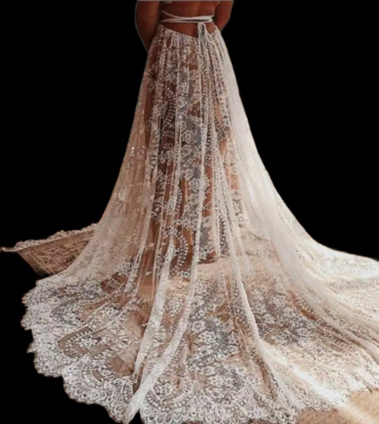 Atelier Calliste boho wedding dress from CELINE featuring flowing fabric and intricate lace details on a model.