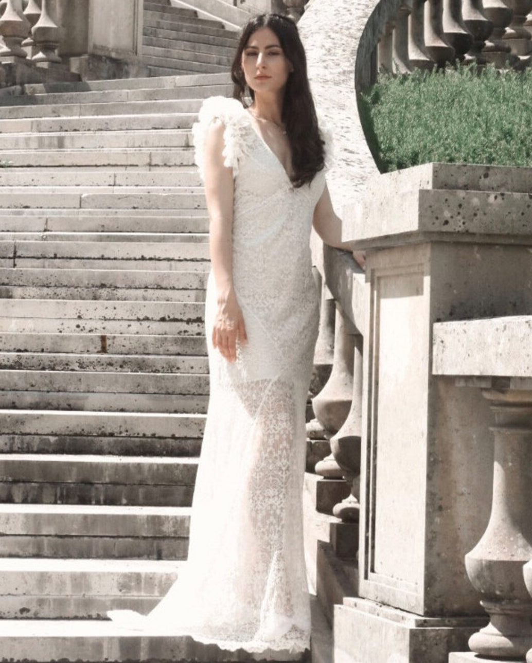 SWAN Ofelia lace boho wedding dress by PETRA KARA BRIDAL featuring delicate lace details and a flowing bohemian silhouette.