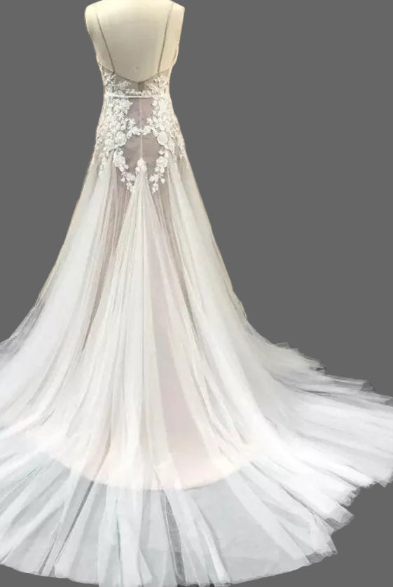 Elegant Lake Nymph Calliste wedding dress by Atelier Calliste featuring a flowing gown with intricate lace details.
