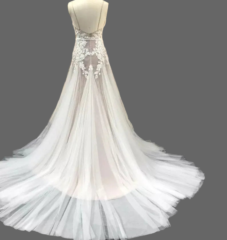Elegant Lake Nymph Calliste wedding dress by Atelier Calliste featuring a flowing gown with intricate lace details.