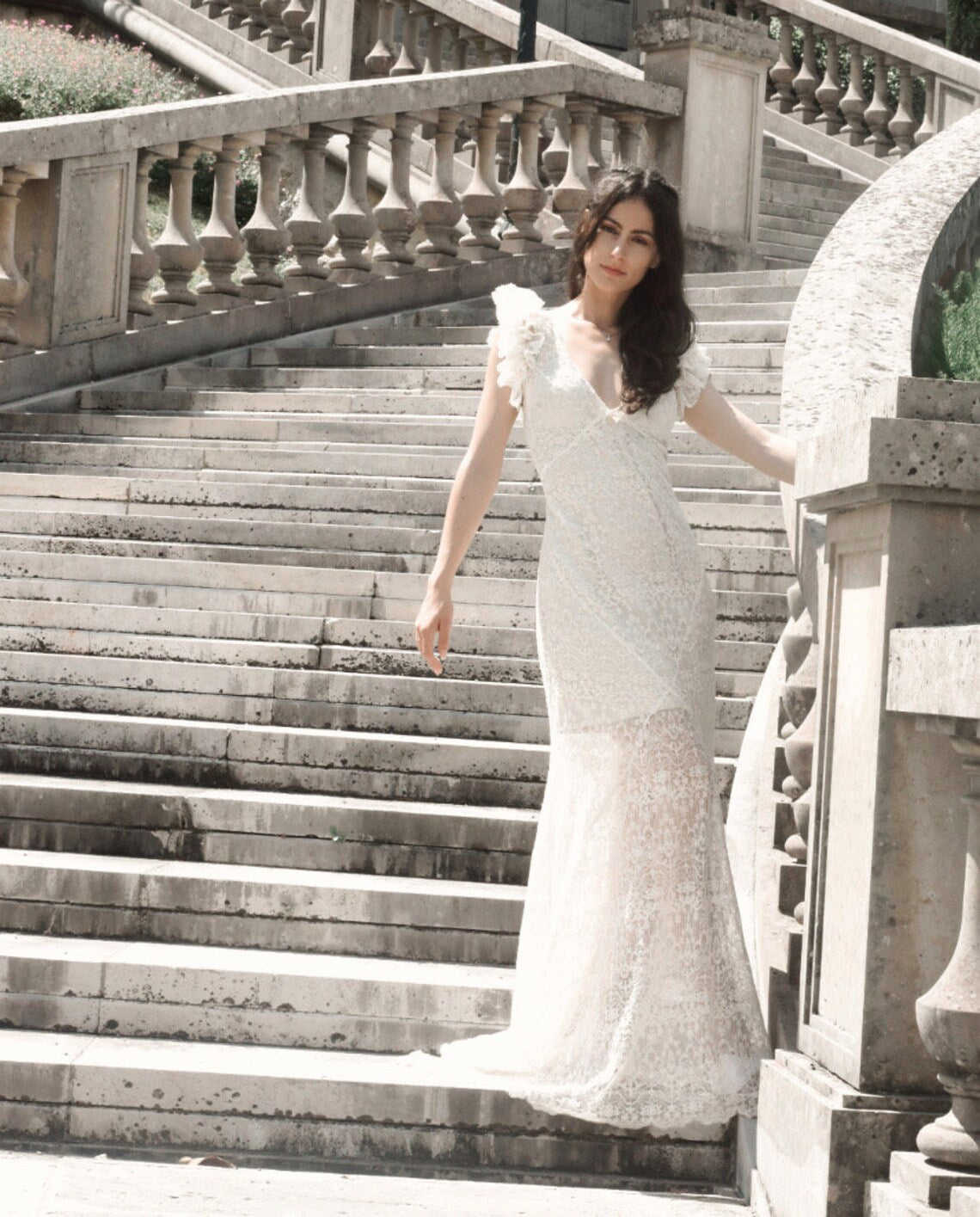 SWAN Ofelia lace boho wedding dress by Petra Kara Bridal featuring intricate lace details and flowing bohemian style.