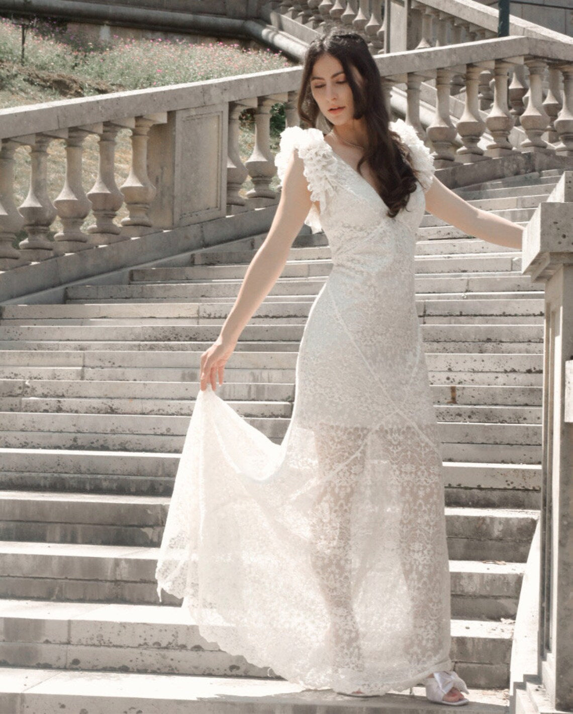 Swan Ofelia lace boho wedding dress by Petra Kara Bridal featuring intricate lace details and a flowing bohemian silhouette.