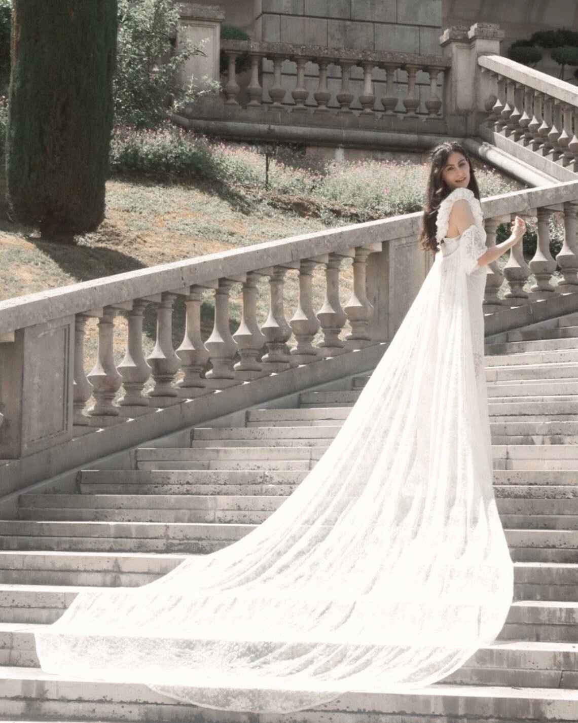 SWAN Ofelia lace boho wedding dress by PETRA KARA BRIDAL featuring intricate lace details and a flowing bohemian silhouette.