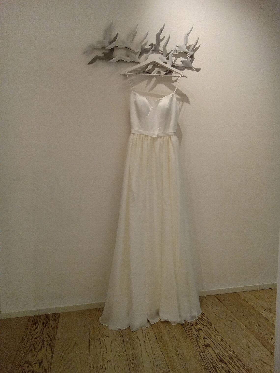 Elegant BALLET wedding dress by Atelier Calliste with intricate lace details and a flowing train, perfect for a bridal ceremony.
