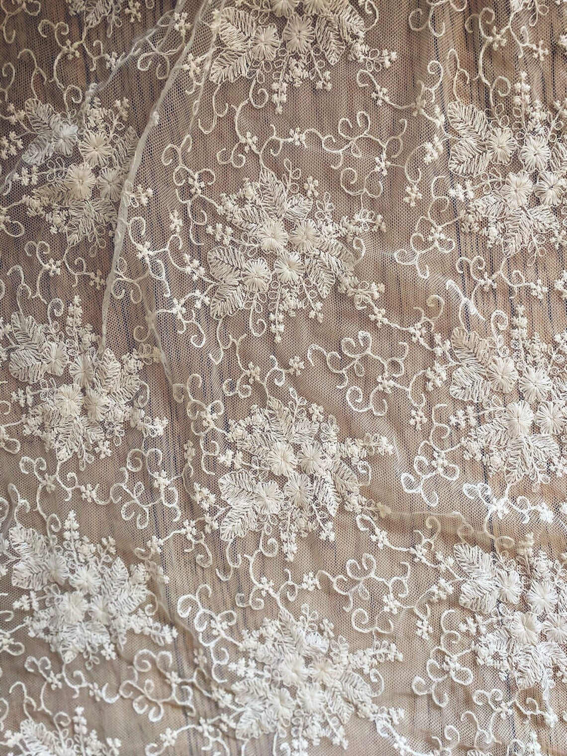SWAN Ofelia lace boho wedding dress by PETRA KARA BRIDAL featuring intricate lace details and flowing bohemian silhouette.