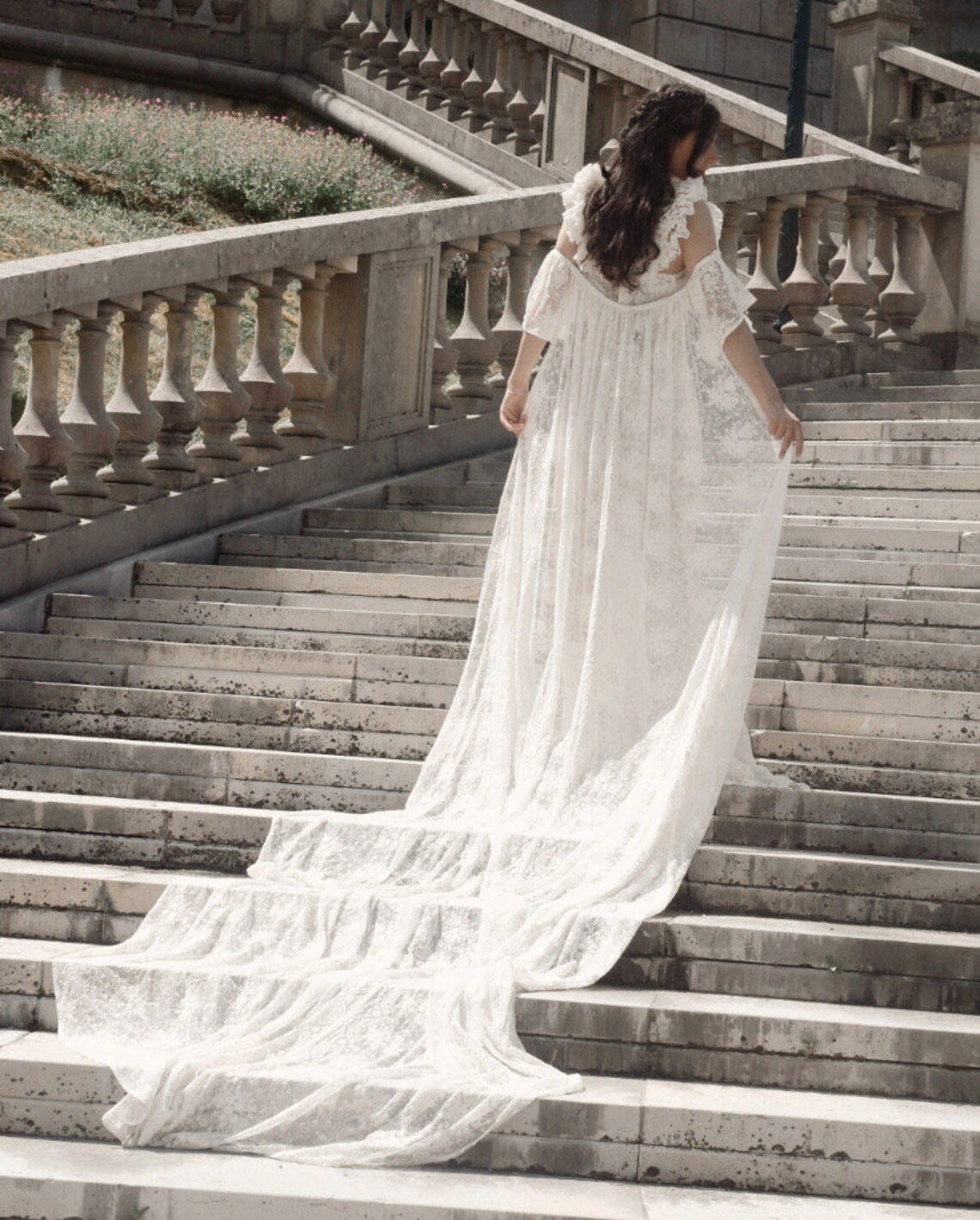 SWAN Ofelia lace boho wedding dress by PETRA KARA BRIDAL featuring intricate lace details and a flowing bohemian silhouette.