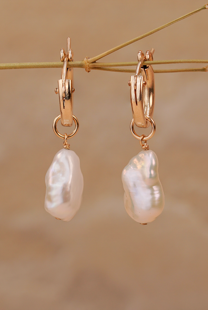 PM Atelier Alyssa Baroque Pearl Organic Drop Mini Huggies earrings with elegant pearl drops and gold hoops.