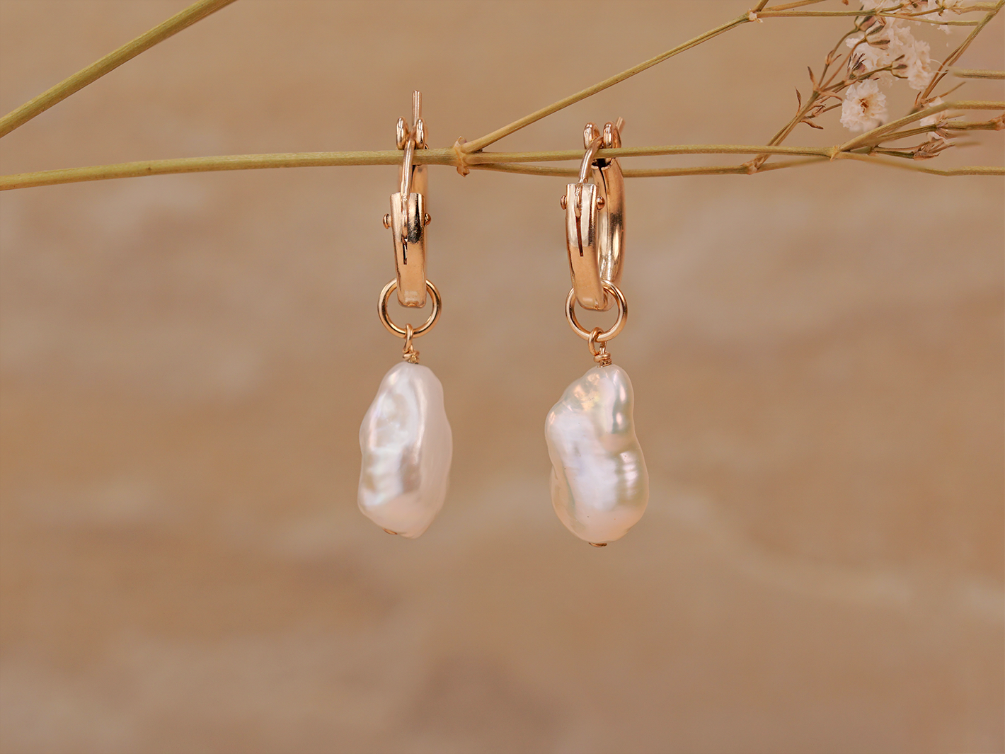 PM Atelier Alyssa Baroque Pearl Organic Drop Mini Huggies earrings with elegant pearl drops and gold hoops.