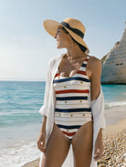 Petra Kara Limited striped swimsuit with bold pattern, featuring classic design and vibrant colors, ideal for beach or poolside wear.
