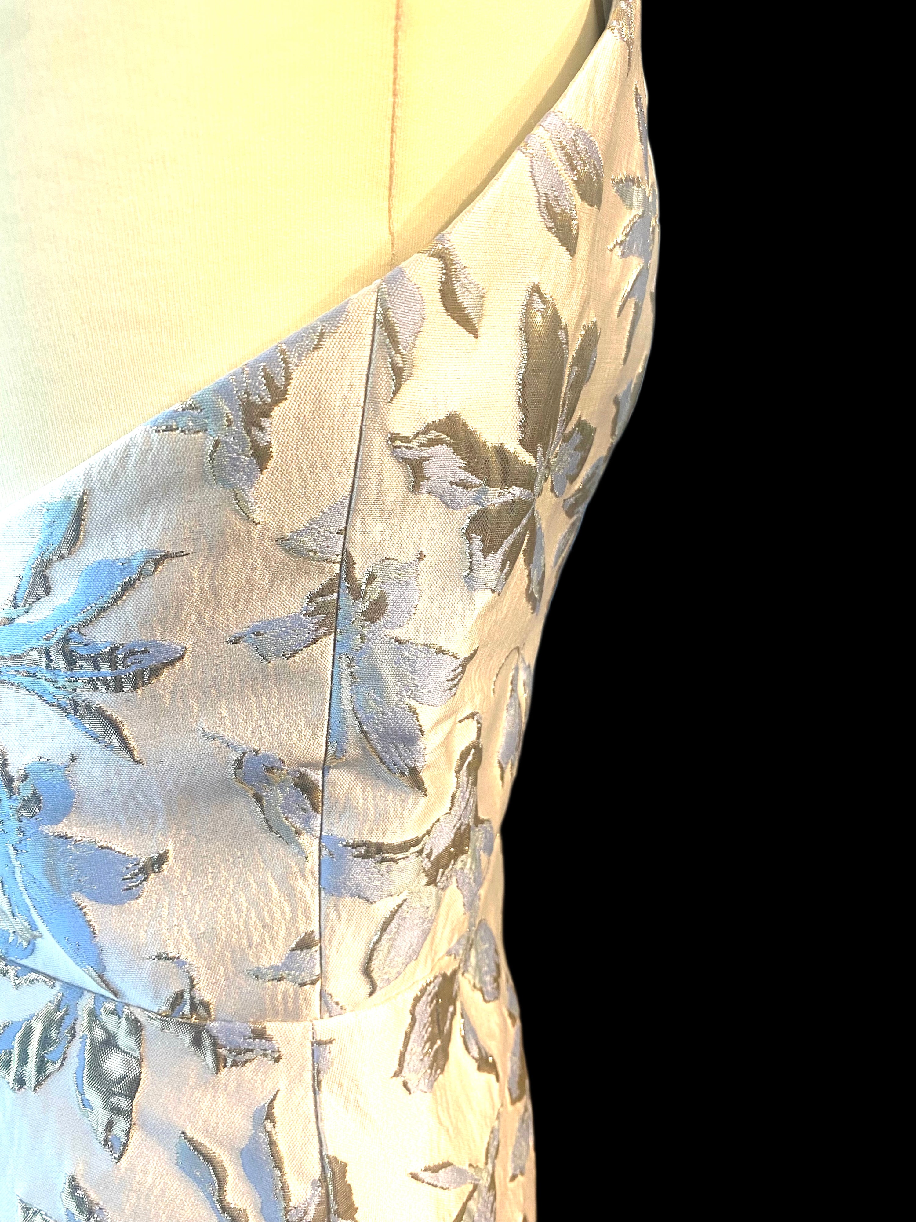 Petra Kara gold and blue floral midi dress displayed on a model, showcasing elegant pattern and flowing fabric.