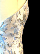 Gold blue floral PETRA KARA midi dress with a fitted bodice and flowing skirt, perfect for summer occasions