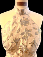 Petra Kara gold and blue floral midi dress with a fitted waist and flowing skirt, perfect for elegant occasions.