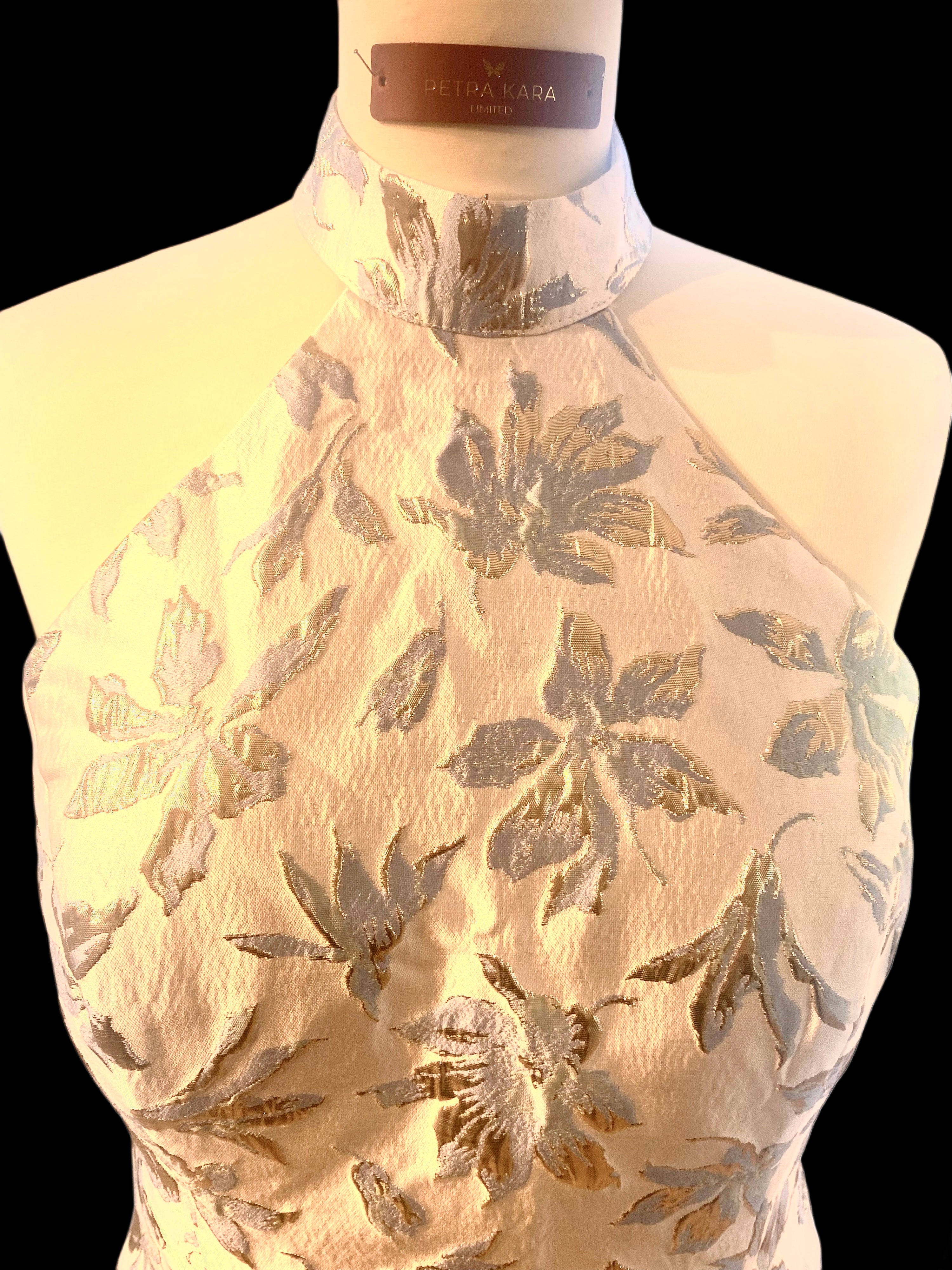 Petra Kara gold and blue floral midi dress with a fitted waist and flowing skirt, perfect for elegant occasions.