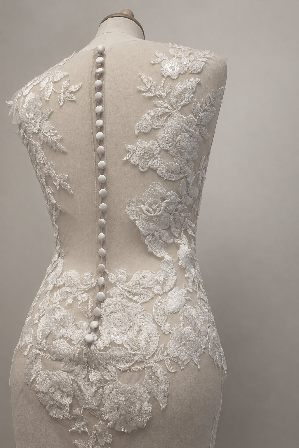 PETRA KARA Mythic Nymph bridal bodysuit top featuring delicate lace and sheer fabric with floral embroidery, perfect for wedding attire.
