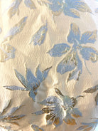 Petra Kara gold and blue floral midi dress with a fitted waist and flowing skirt, perfect for summer or special occasions.