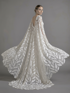 Elegant feather veil and cape by Atelier Calliste, showcasing delicate feather details and flowing fabric for a sophisticated look.