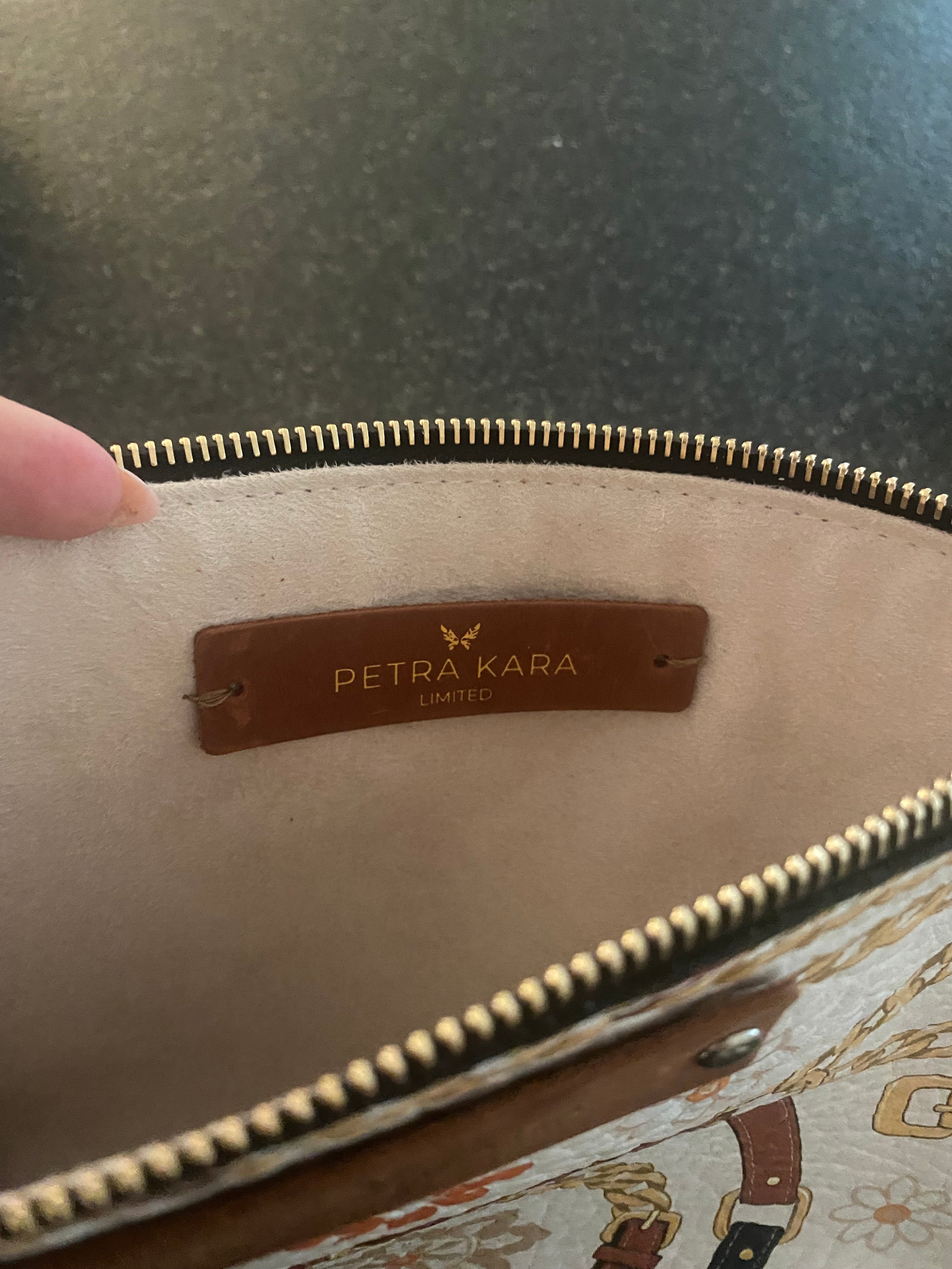 Petra Kara Leather Purse from the Revolution Limited Collection, Captain style, with sleek black leather and gold accents.