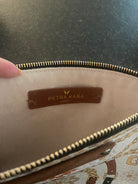 Petra Kara Leather Purse from the Revolution Limited Collection, Captain style, with sleek black leather and gold accents.