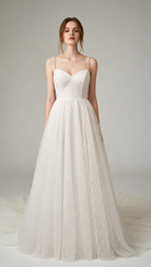 Boho wedding dress by Atelier Calliste with star embellishments, flowing fabric, and elegant design for bohemian bridal style.