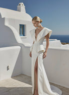 Elegant Cyclades architectural dress by PETRA KARA featuring intricate design and flowing fabric, showcased on a mannequin.