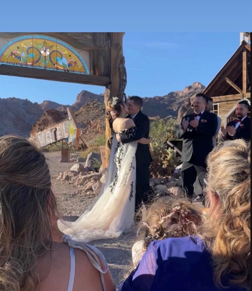 Ethereal Mystique Nymph wedding dress by Atelier Calliste featuring flowing fabric and delicate lace details on a bride.