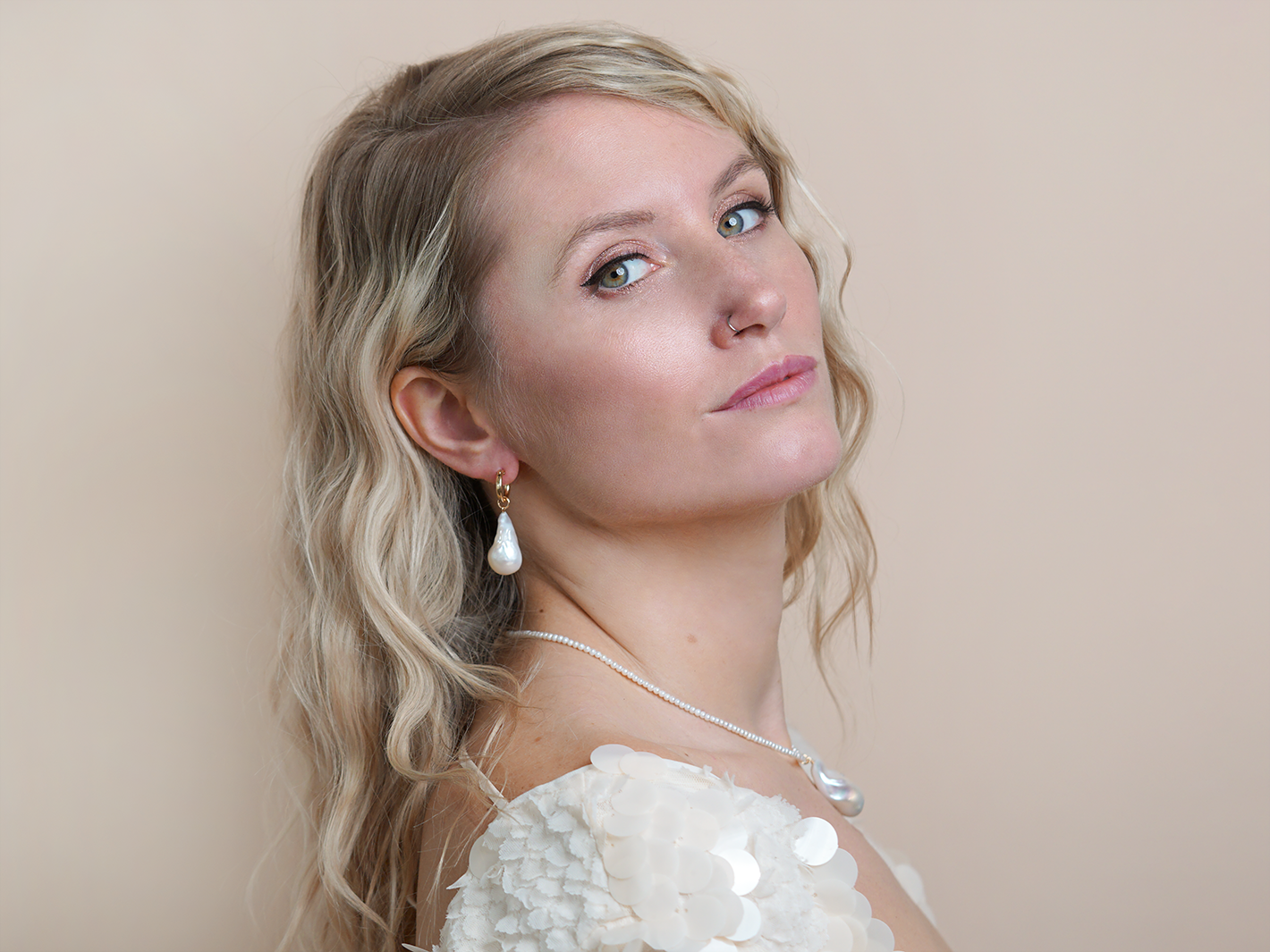 PM Atelier Paris Hoops earrings, gold-tone hoops with a sleek, modern design, shown on a white background.