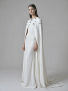 Beaded cape by Atelier Calliste in size S to XXXL, featuring intricate beadwork and elegant drape.