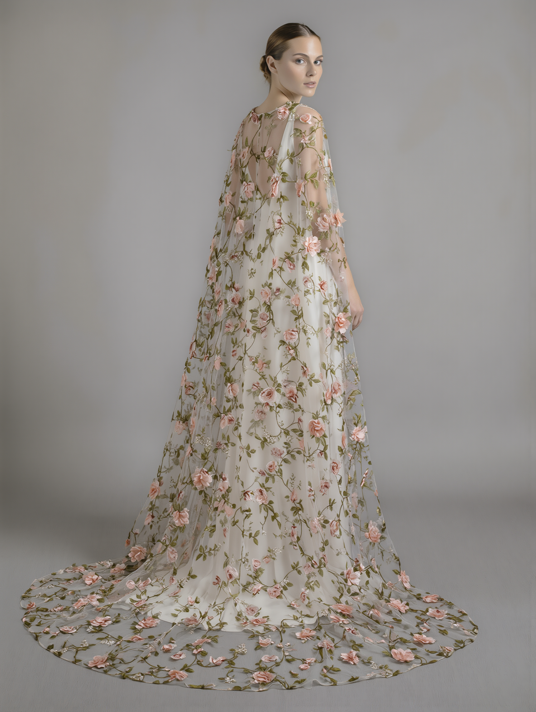 Romantic floral cape from Atelier Calliste in S to XXL size, featuring delicate flower patterns and lightweight fabric.