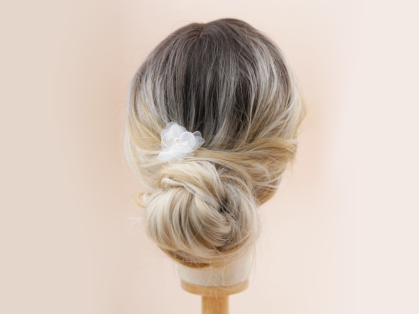 Clear floral bridal hair pin by PM Atelier featuring delicate sheer flower design for elegant wedding hairstyles.